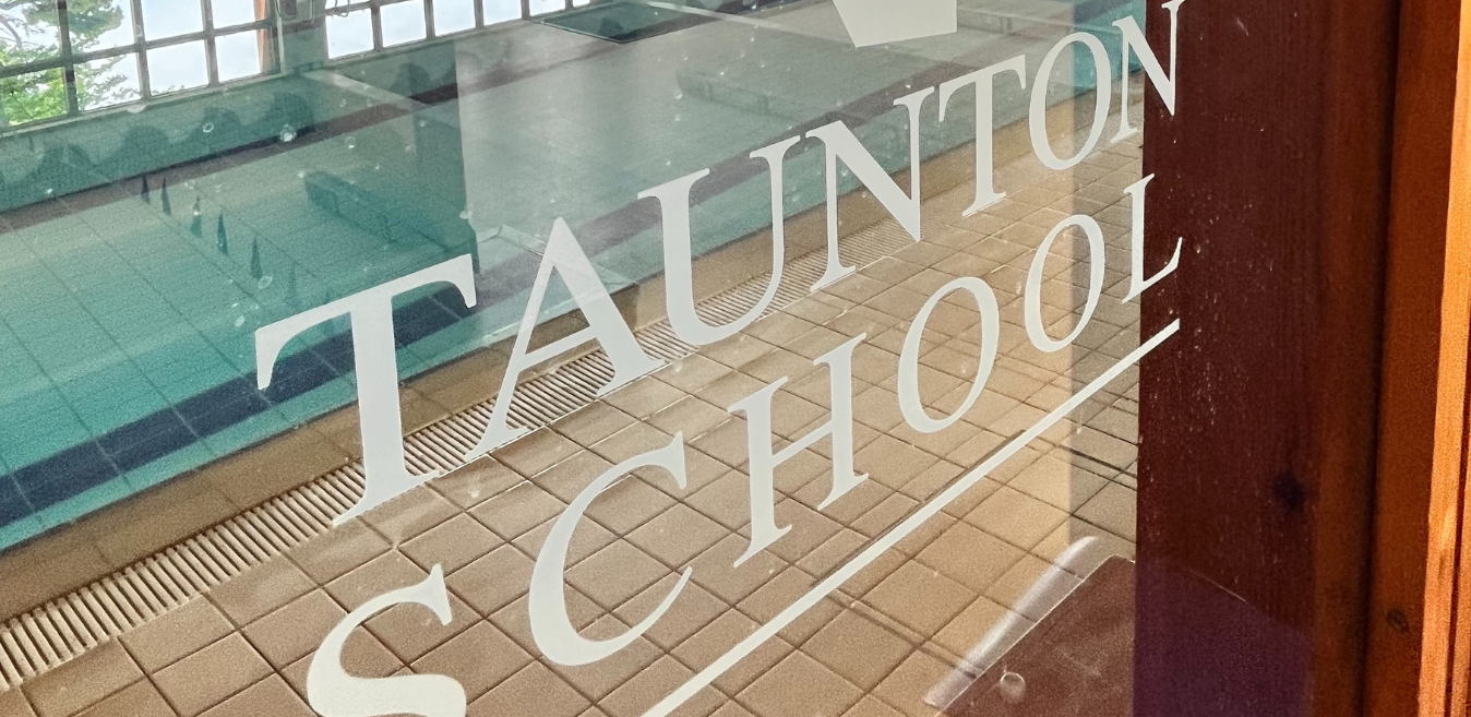 Taunton School logo in window